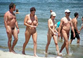 Nudist family at the beach